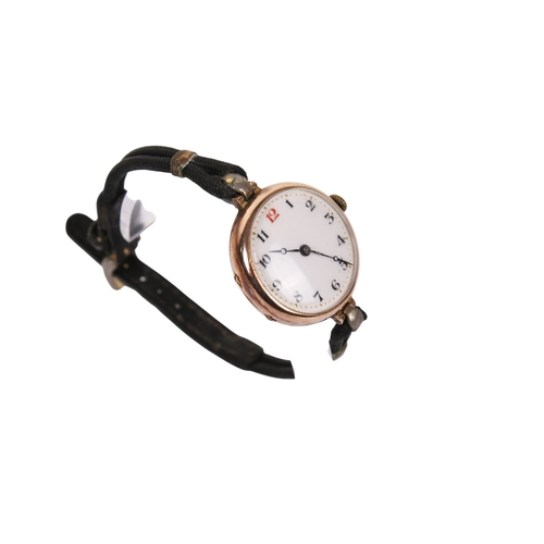 371 - A 9ct gold cased wristwatch. The white enamel face with black and red Arabic numerals, hallmarks to ... 