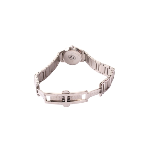 387 - A lady's Maurice Lacroix wristwatch. The black dial surrounded by a stainless steel bezel with Roman... 
