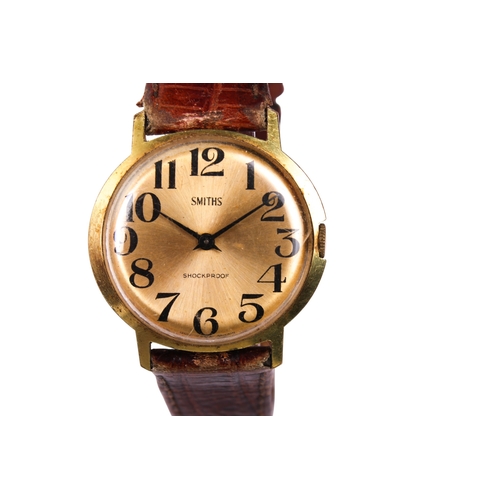 393 - A gentleman's vintage Smiths wristwatch. The gilt face having Arabic numerals, in a gold plated case... 