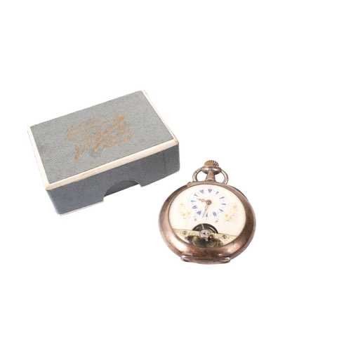 422 - A Swiss 'Hebdomas' style silver pocket watch. With blue Roman numerals and gilt floral decoration to... 