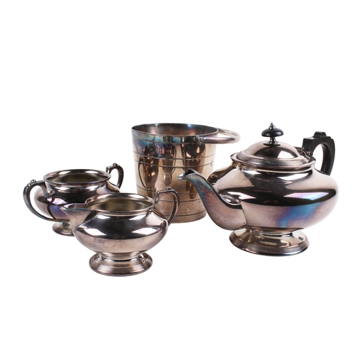 262 - A silverplated three-piece tea set and an ice bucket. Consisting of a tea pot, sugar bowl and milk j... 