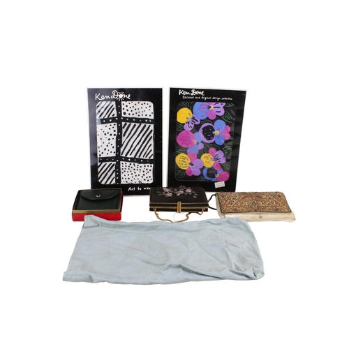 278 - A collection of women's fashion textiles. Including two handbags, a wallet and two silk scarves by A... 