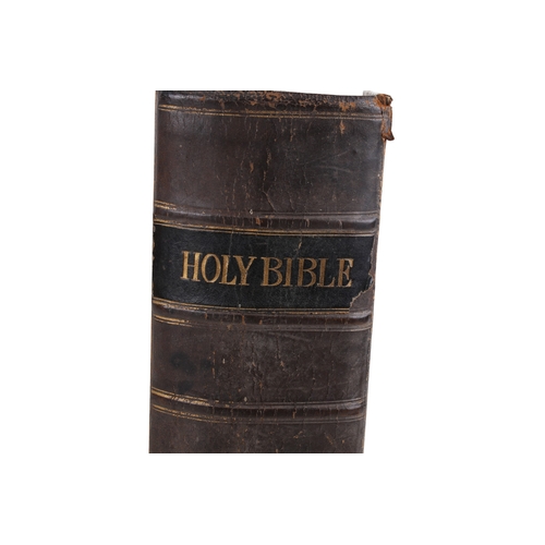 280 - Two antique books. Including a 19th century family Bible and Hoppus's Practical measurer.