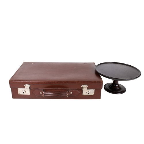 336 - A gentleman's vintage brown leather suitcase and a mahogany centre piece. Max. H15cm. (2).