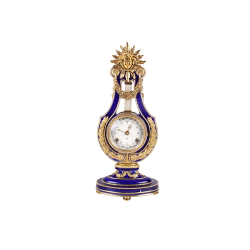 337 - A V&A 'Marie-Antoinette Clock and key. Gilt and blue glazed porcelain, cream dial with Roman numeral... 