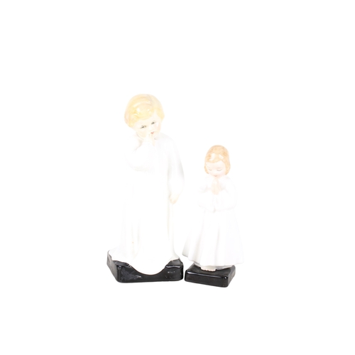 347 - Two Royal Doulton figures of children. Comprising 'Darling' HN 1319 and 'Bedtime' HN 1978. Max. H19c... 