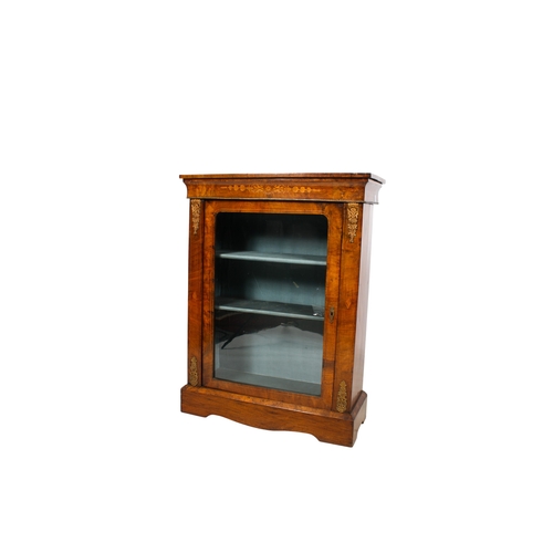 391 - A 19th century inlaid mahogany pier cabinet. Having a glazed door opening to reveal two fixed shelve... 