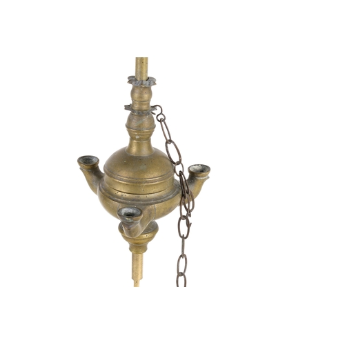 510 - A late 19th century Lucerne brass oil lamp. Having a handle to the top, mounted on a circular base, ... 