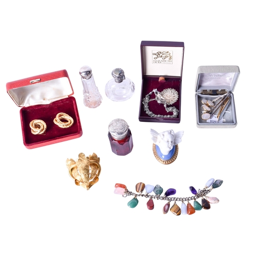 141 - A collection of vintage scent bottles and costume jewellery. The red and colourless cut glass bottle... 