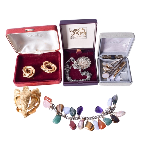 141 - A collection of vintage scent bottles and costume jewellery. The red and colourless cut glass bottle... 