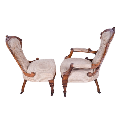 159 - A pair of 20th century chairs. Comprising an armchair and a nursing chair, both with carved wooden f... 