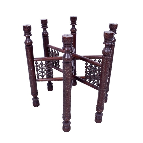 168 - An anglo Indian folding brass tray top table. The circular top engraved with stars and bands, the wo... 