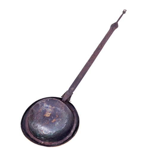 192 - A vintage bed warmer. Having a metal handle and brass cover with impressed decoration, L97.5cm.