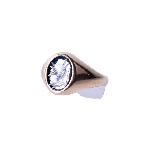 20 - A 9ct gold and hematite signet ring. With engraved oval stone, hallmarked, size M, gross weight 3g.