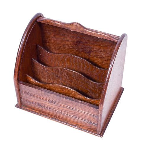 211 - An oak letter rack and a Mary 1914 Christmas tin. The rack having a tambour front and containing fou... 