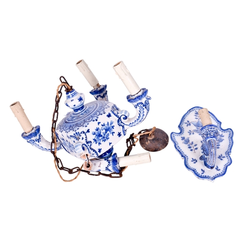 218 - A Portugese ceramic wall sconce and a four branch chandelier. Both glazed in white with blue decorat... 