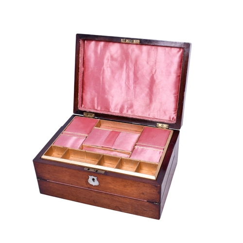 238 - A Victorian rosewood sewing/writing box. The exterior having a mother of pearl escutcheon, the inter... 