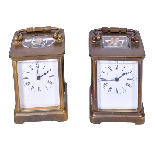 308 - Two brass cased carriage clocks. Both having white enamel dials with Roman numerals, glazed panels t... 
