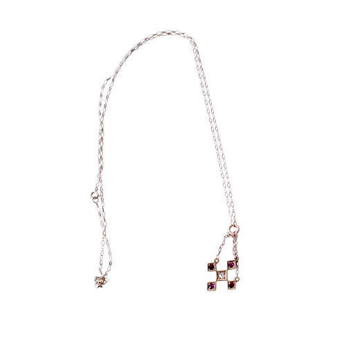 36 - An early 20th century 18ct gold (stamped) pendant. Set centrally with one old cut diamond of 0.05 ca... 