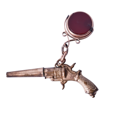 37 - A 9ct gold fob with a gilt metal pendant firearm. The fob set with bloodstone and carnelian in a hal... 