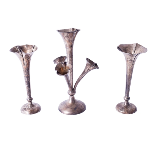 4 - A pair of vintage silver weighted tulip vases and a silver epergne. The first with trefoil rim, thes... 