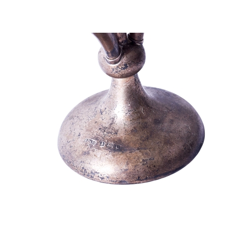 4 - A pair of vintage silver weighted tulip vases and a silver epergne. The first with trefoil rim, thes... 