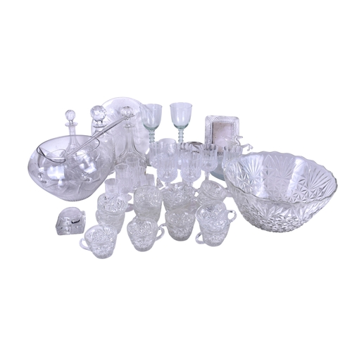 601 - A collection of assorted modern glassware. Including two punch bowls and mugs, a photo frame and thr... 