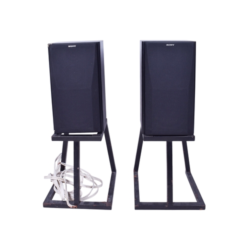 614 - A pair of Sony freestanding speakers and a Cambridge Audio amp. The speakers mounted on metal stands... 