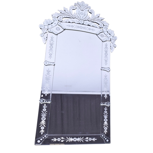 615 - A contemporary Venetian style wall mirror. Of rectangular form with floral decoration and a pediment... 