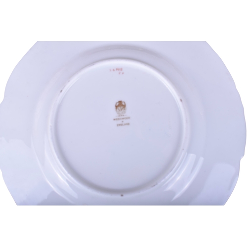 620 - A collection of Wedgwood plates. Comprising two oval and six circular examples, glazed in white with... 