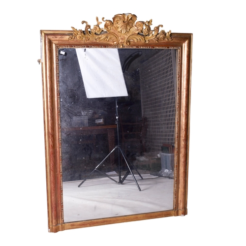 625 - A 19th century large gilt framed rectangular wall mirror. The frame having floral engraved decoratio... 