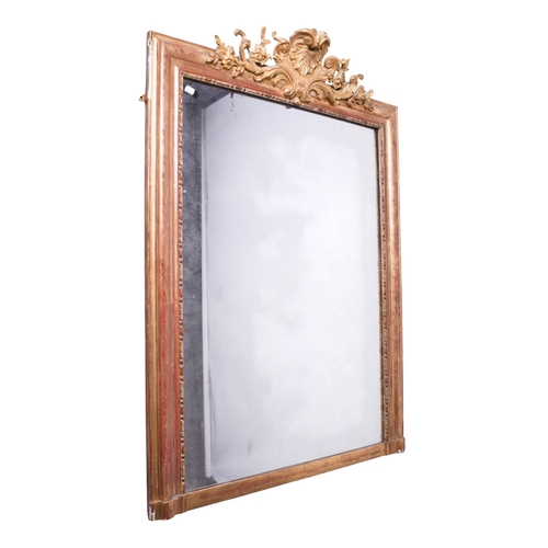 625 - A 19th century large gilt framed rectangular wall mirror. The frame having floral engraved decoratio... 