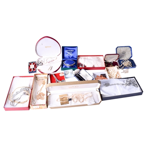 76 - Two boxes of assorted silver and costume jewellery. Including earrings, brooches, vintage faux pearl... 