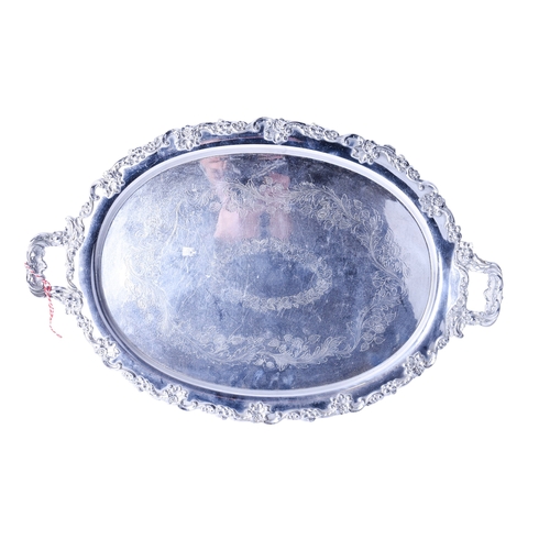 91 - A silverplated twin-handled tray. Of oval form, with a moulded floral border and etched decoration, ... 