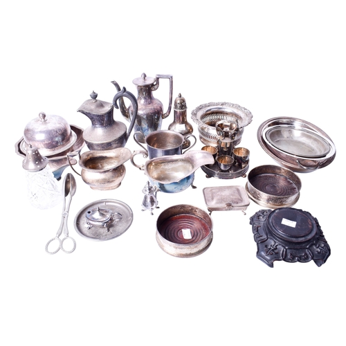 94 - An assortment of Victorian and later silverplated items. Including a sugar shaker, sauceboats, teapo... 