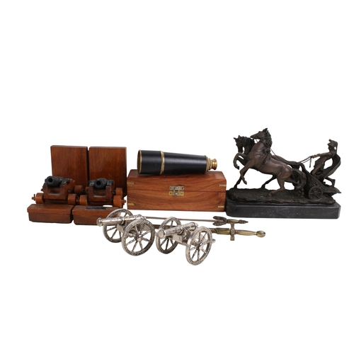 281 - A group of assorted modern collectables. Including a cased telescope, a pair of canon bookends and a... 