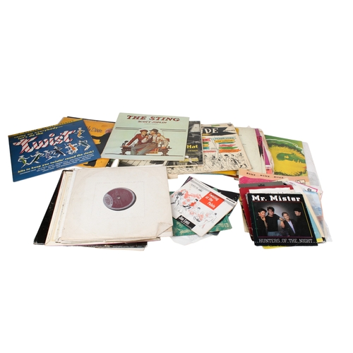 345 - A collection of assorted vintage vinyl records. Including LPs and 7 inch singles.