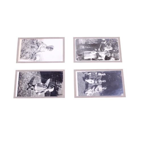 403 - An early 20th century silver gelatin photograph album. Containing mostly family photographs with som... 