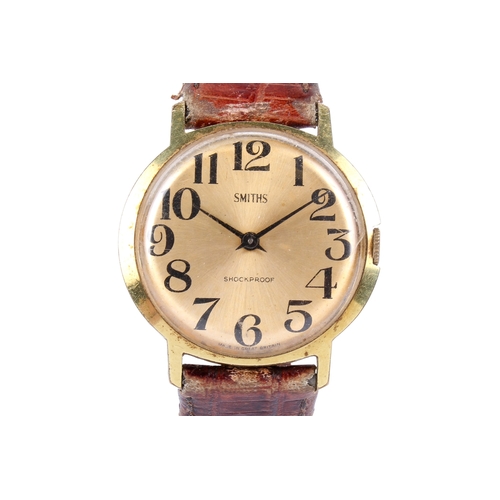 51 - A gentleman's vintage Smiths wristwatch. The gilt face having Arabic numerals, in a gold plated case... 