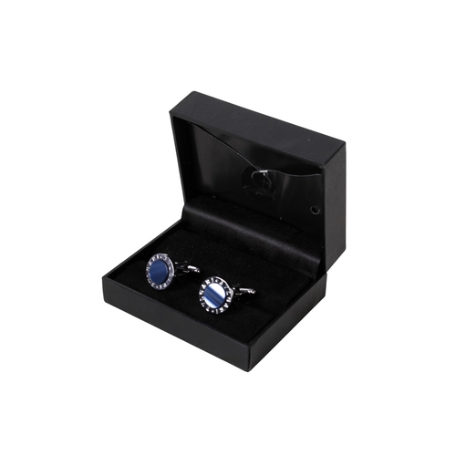 64 - A pair of Bulgari white metal and cufflinks. Inset with blue panels encircled by the company name, d... 