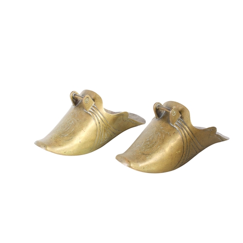 525 - A pair of solid brass 'conquistador' horse riding enclosed stirrups. Having engraved decoration. H12... 