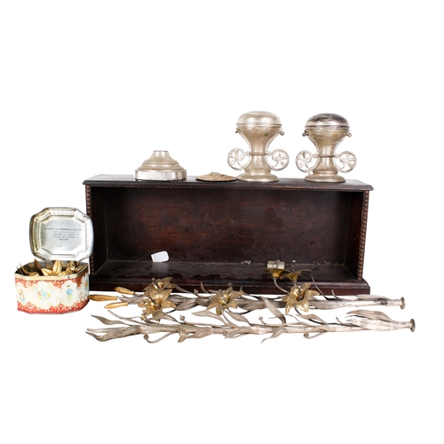 580 - A white metal table centrepiece decoration. Modelled as sprigs of gilt flowers in an urn, unassemble... 