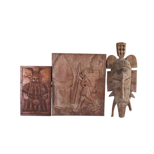 519 - A group of three African Tribal wood carvings. Including a mask, etc. Max. 35cm x 42cm