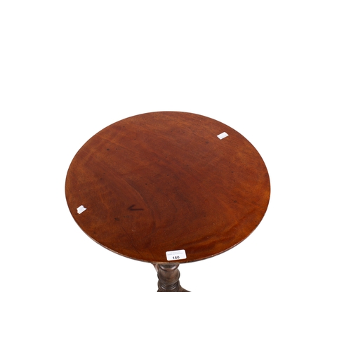 160 - An early 20th century mahogany wine table. The circular top mounted on a turned and tapered stand te... 