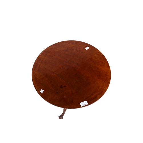 160 - An early 20th century mahogany wine table. The circular top mounted on a turned and tapered stand te... 