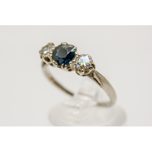 119 - An 18ct gold, sapphire and diamond ring. The central stone circa 0.6ct estimated weight, the diamond... 