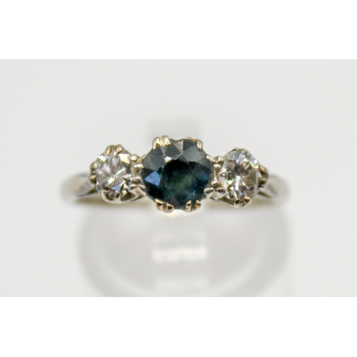 119 - An 18ct gold, sapphire and diamond ring. The central stone circa 0.6ct estimated weight, the diamond... 