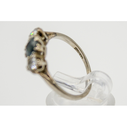 119 - An 18ct gold, sapphire and diamond ring. The central stone circa 0.6ct estimated weight, the diamond... 