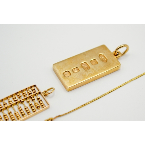 168 - Three gold and yellow metal pendants and necklace. Including a hallmarked 9ct gold ingot, weight 15.... 