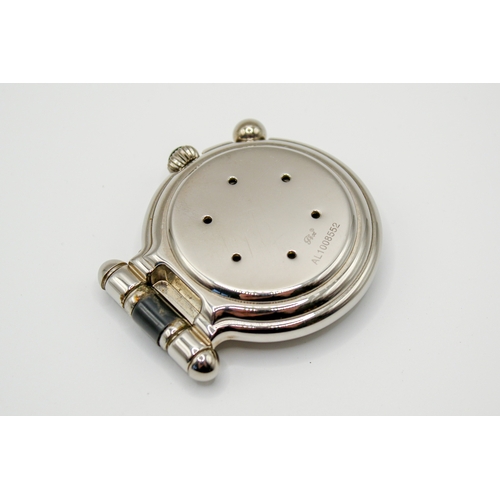 204 - A Montblanc pocket travel alarm clock. Having a white dial, Arabic numerals, stainless steel case wi... 